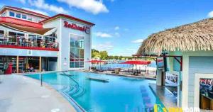 a large swimming pool in front of a hotel at Baypoint Paradise in Osage Beach