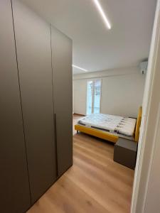 a small room with a bed and a closet at mama house in Marotta