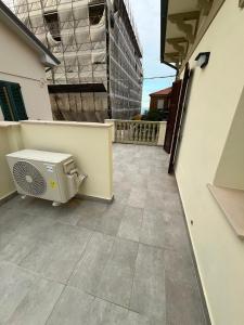 a patio with a heater on the side of a building at mama house in Marotta