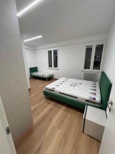 a room with a bed and two benches in it at mama house in Marotta +6 photos