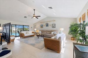 a living room with a couch and a tv at 830 Coronado in Punta Gorda