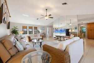 a living room with a couch and a table at 830 Coronado in Punta Gorda +35 photos