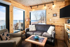 a living room with a couch and a table at Lutsen Sea Villas in Lutsen