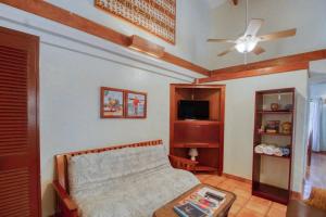 a bedroom with a bed and a ceiling fan at Condo #27 @ Beachside Villas in Seine Bight Village
