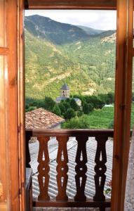 a window view of a view of a mountain at Casa Peiró in Coll
