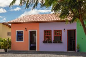 a small house painted in different colors at Vila Caetité - Mucugê in Mucugê +29 photos
