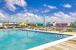 a pool on the roof of a building at Suite E303 Mara Laguna in San Pedro