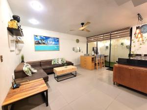 a living room with a couch and a table at Home La Reina in Guadalajara