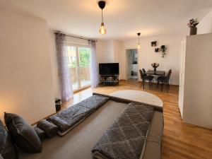 a living room with a large couch and a table at Modern Comfort Apartment with Balcony in Dresden