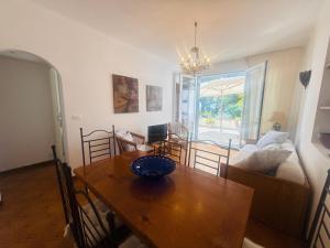 a living room with a table and a dining room at Villa Fronte Mare Con Terrazza in Marina di Andora +32 photos