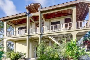 a house with balconies on the side of it at Suite at Villa Maya -Gold Standard and Certified in San Ignacio