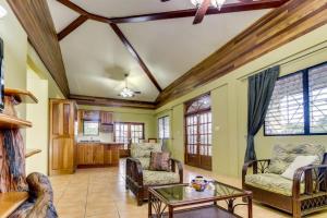 a living room with a couch and a table at Suite at Villa Maya -Gold Standard and Certified in San Ignacio