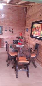 a dining room with a table and chairs at Hospedaje Los Tumbilos in Silos +15 photos
