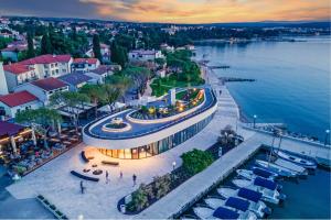 an aerial view of a large building next to the water at Penthouse Apartment Maya with Pool and Jacuzzi in Sveti Anton