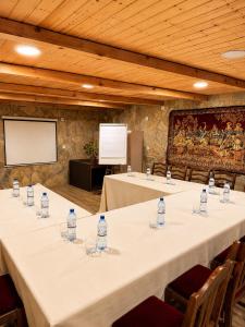 a meeting room with tables with bottles of water at სასტუმრო ამელი/Hotel Ameli in Telavi