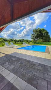 an image of a swimming pool in a house at Sunny Funny House in Čačak