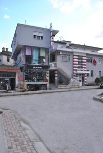 an empty street in front of a building at Eden Hotel in Gjirokastër