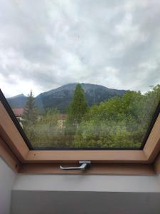 a window with a view of a mountain at Apartmán Štiavnik in Vysoké Tatry