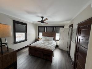 a bedroom with a bed and a ceiling fan at Esplanade at Clear Lake in Waseca
