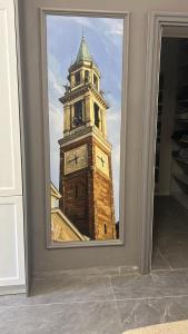 a reflection of a clock tower in a mirror at Il campanile in Corbetta