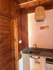 a bathroom with a sink and a wooden wall at Leonessa's Villa in Dahab +35 photos