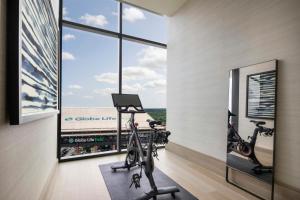 a fitness room with two treadmills and a gym at Loews Arlington Hotel in Arlington