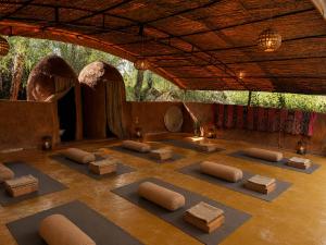 a room with yoga mats on the floor at La Ferme Berbere in Marrakesh