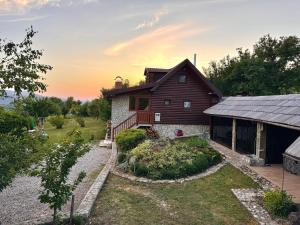 an image of a house with a yard at Cozy Green Escape in Kakanj