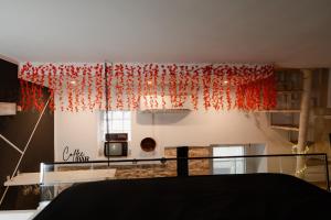 a room with red curtains on a wall at Mariposa cinema in Grumo Appula +7 photos