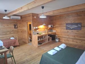 a room with wooden walls and a room with a bed and a desk at FISHERMAN Setúbal in Setúbal