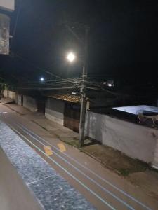 a street at night with a street light at Kiko Schettino in Angra dos Reis