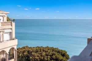 a view of the ocean from a building at Victoria Bergamote Attic with Terrace and Sea View - Happy Rentals in Menton