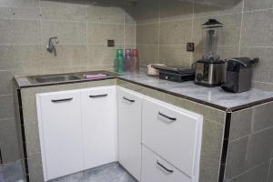a kitchen with a sink and a counter top at oasis house in Takchrirt