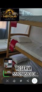 a poster for a bedroom with a bunk bed at HBTOUR Latin in Manaus