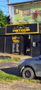 a car parked in front of a car shop at HBTOUR Latin in Manaus