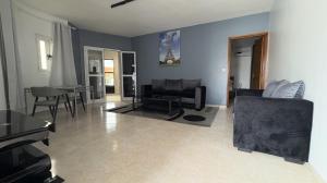 a living room with a couch and a table at RESIDENCE ADSL Studio BOUYGUES in Dakar