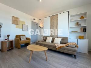 a living room with a couch and a table at GC - Au Large - Front de Mer in Wissant