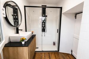 a bathroom with a sink and a shower at Rivera de Poulo in Ordes +20 photos