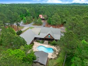 an overhead view of a house with a swimming pool at Heated Pool, 7 Bedroom Cabin, 6,000 Square Feet, Arcade! in Broken Bow