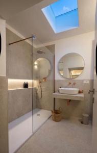 a bathroom with a shower and a sink and a mirror at Casa Nacci Accoglienza di Lusso in Brindisi +42 photos