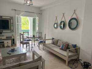 a living room with a couch and a table at Arabesque-style apartment in Yasmine