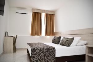 Voodi või voodid majutusasutuse Hotel Kurakatá toas