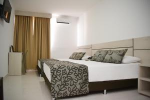 Voodi või voodid majutusasutuse Hotel Kurakatá toas