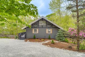 a home with a gray house in the woods at 'Bear Crossing Chalet:' Beech Mountain Family Home in Beech Mountain