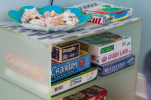 a shelf with a plate of food on top of foodiger at Lakefront Getaway with Dock, Pool, Sunset Games in Greenwood +70 photos