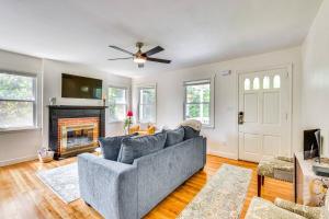a living room with a couch and a fireplace at The Cottage on Corinth in Seneca