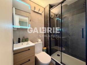 a bathroom with a shower and a toilet and a sink at GC - Le Panorama - Front de Mer in Wissant +16 photos
