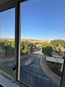 a view of a street from a window at Victoria Centre 2BR - Opposite Bus Terminal in Victoria