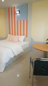 เตียงในห้องที่ Juntima Place at Amphawa