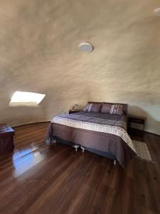 a bedroom with a bed in a room at Entre Dunas y Caracolas in Punta de Choros +108 photos